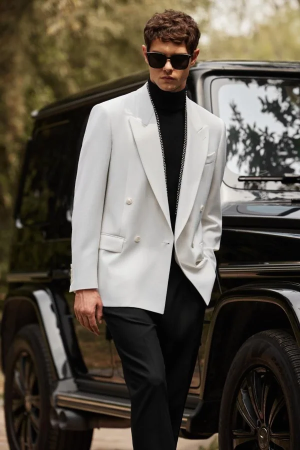 Ivory Nocturne: Ivory double-breasted jacket, black turtleneck and black trousers, editorial inspiration reference photograph