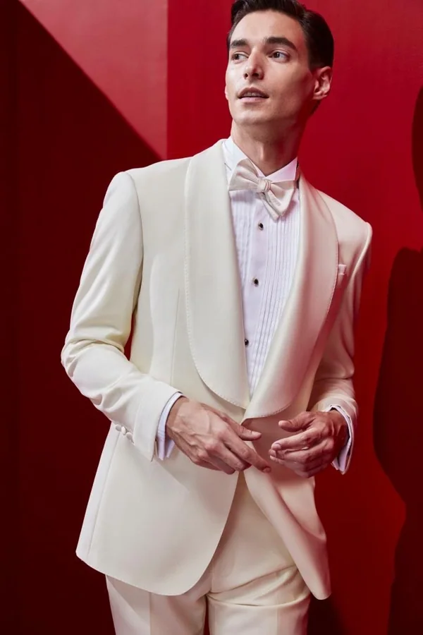 White Reverie: Ivory shawl tuxedo with white bow, editorial inspiration reference photograph