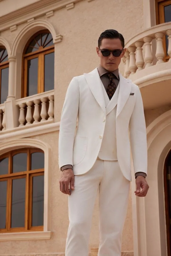 Ivory Accord: Ivory three-piece suit with taupe shirt, editorial inspiration reference photograph