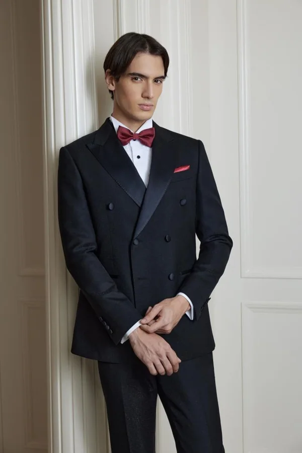 Evening Overture: Black double-breasted tuxedo with burgundy bow, editorial inspiration reference photograph
