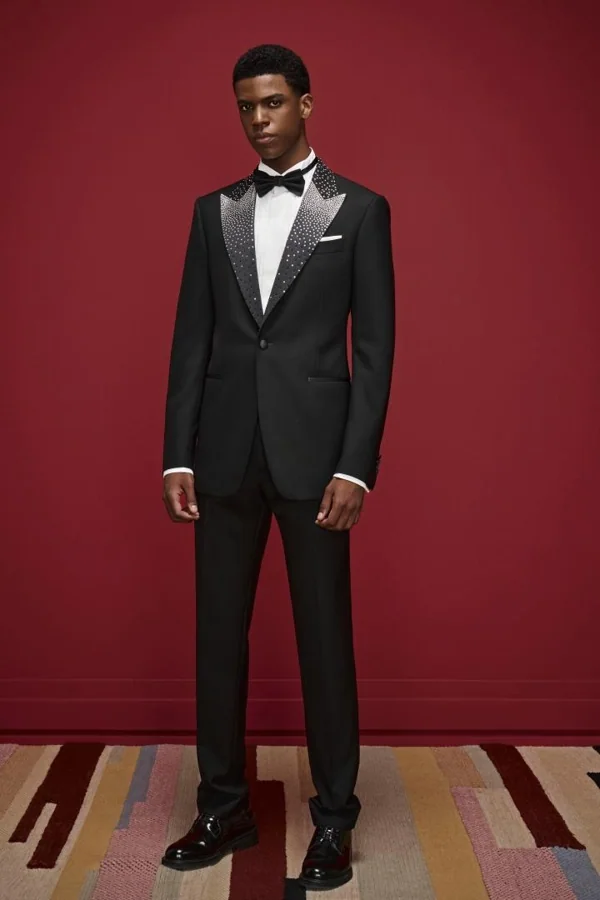 Starlit Atelier: Black tuxedo with embellished lapel and black bow, editorial inspiration reference photograph
