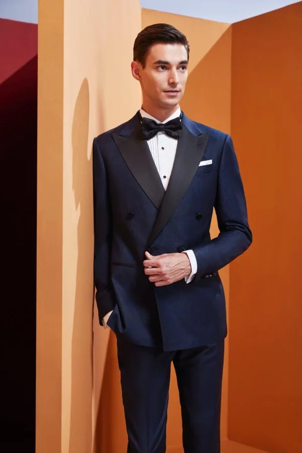 Navy Coda: Navy double-breasted satin-lapel tuxedo, editorial inspiration reference photograph